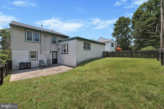 301 W Marshall St, West Chester, PA 19380 - back of property featuring a patio area, a fenced backyard, and stucco siding