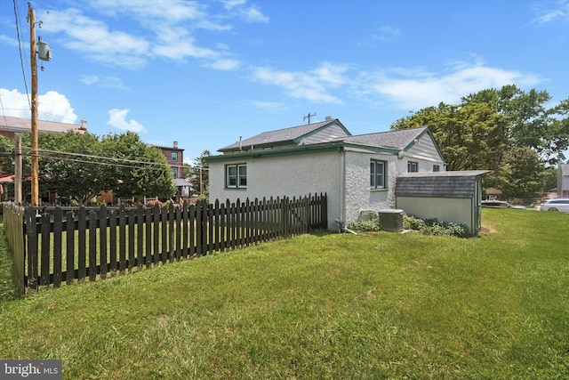 301 W Marshall St, West Chester, PA 19380 - view of side of home featuring stucco siding and a storage unit