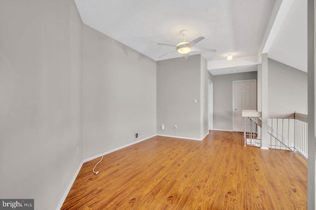 22 Witch Hazel Ct, Monmouth Junction, NJ 08852 - unfurnished room with vaulted ceiling, a ceiling fan, and light wood-type flooring