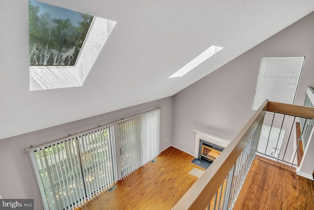 22 Witch Hazel Ct, Monmouth Junction, NJ 08852 - hallway with a skylight, wood finished floors, and high vaulted ceiling