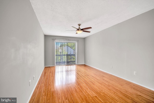 22 Witch Hazel Ct, Monmouth Junction, NJ 08852 - empty room featuring a textured ceiling, ceiling fan, and light wood-style floors