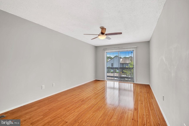 22 Witch Hazel Ct, Monmouth Junction, NJ 08852 - unfurnished room with light wood-style floors, a ceiling fan, and a textured ceiling