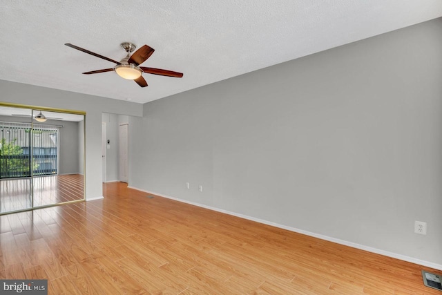 22 Witch Hazel Ct, Monmouth Junction, NJ 08852 - unfurnished room featuring ceiling fan, light wood-style flooring, and a textured ceiling