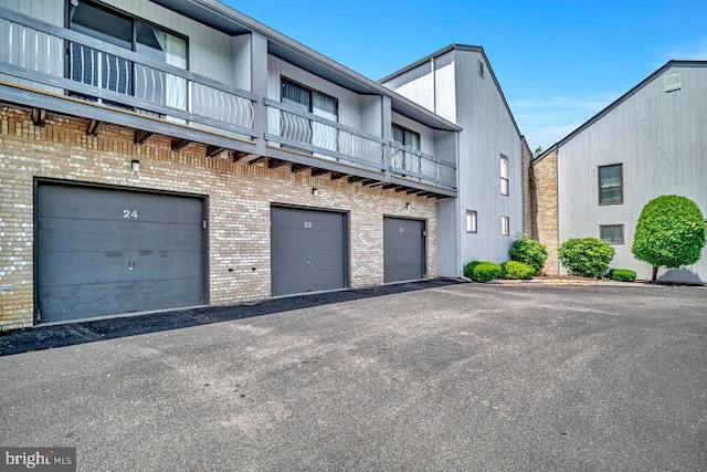 22 Witch Hazel Ct, Monmouth Junction, NJ 08852 - view of property with a garage and asphalt driveway