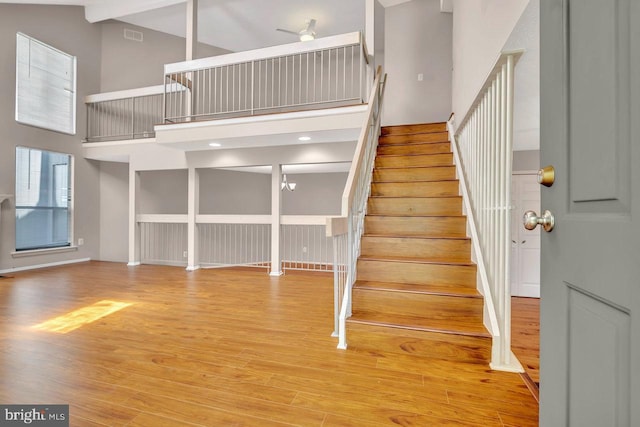 22 Witch Hazel Ct, Monmouth Junction, NJ 08852 - stairway featuring a towering ceiling and wood finished floors