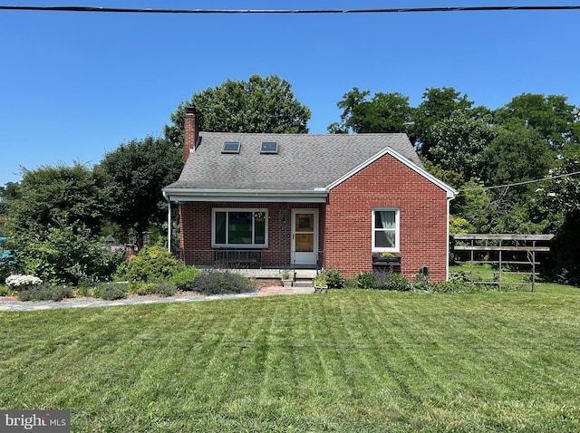 867 Elm St, Bressler, PA 17113 - view of front facade with brick siding, a front lawn, a porch, and a chimney