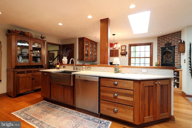 320 Hartswick Ave, State College, PA 16803 - kitchen featuring dishwasher, light wood-type flooring, brown cabinets, glass insert cabinets, and recessed lighting