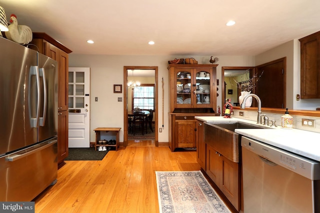 320 Hartswick Ave, State College, PA 16803 - kitchen featuring stainless steel appliances, a chandelier, light wood-style flooring, recessed lighting, and light countertops