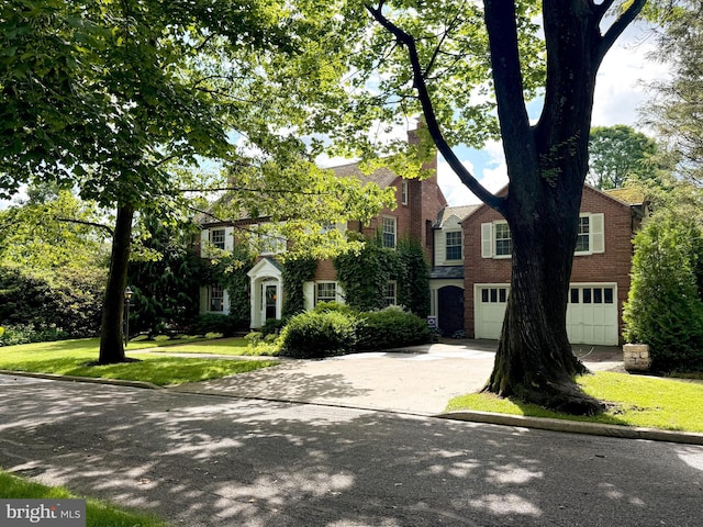 320 Hartswick Ave, State College, PA 16803 - view of front of house with a garage, concrete driveway, and a front lawn