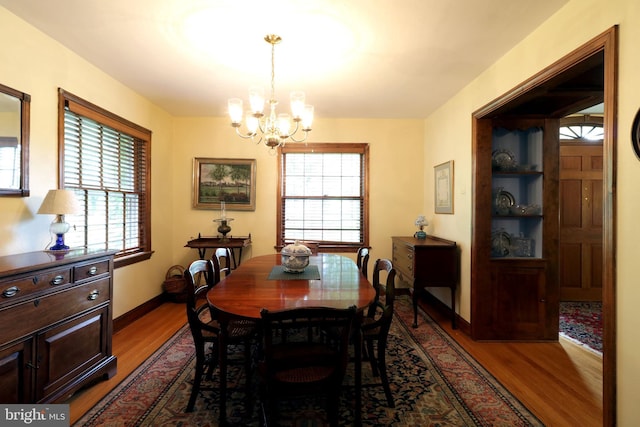 320 Hartswick Ave, State College, PA 16803 - dining room featuring wood finished floors, a chandelier, and plenty of natural light