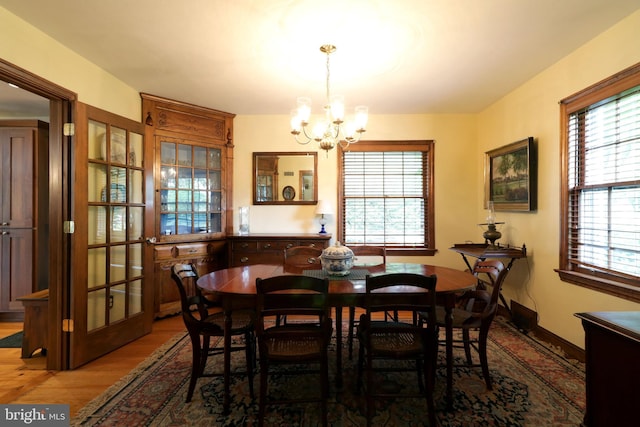 320 Hartswick Ave, State College, PA 16803 - dining area with wood finished floors and a chandelier