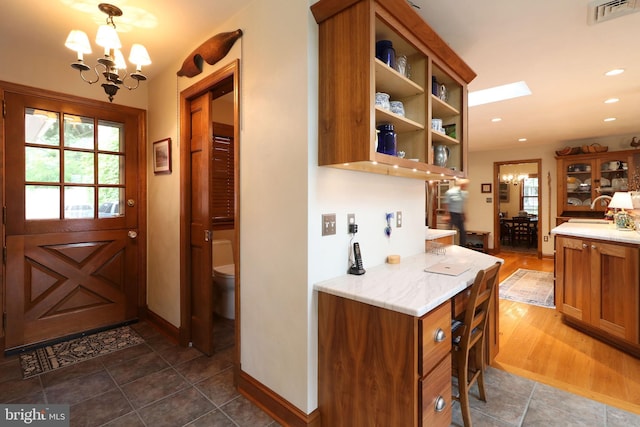 320 Hartswick Ave, State College, PA 16803 - kitchen with a chandelier, brown cabinetry, plenty of natural light, and recessed lighting
