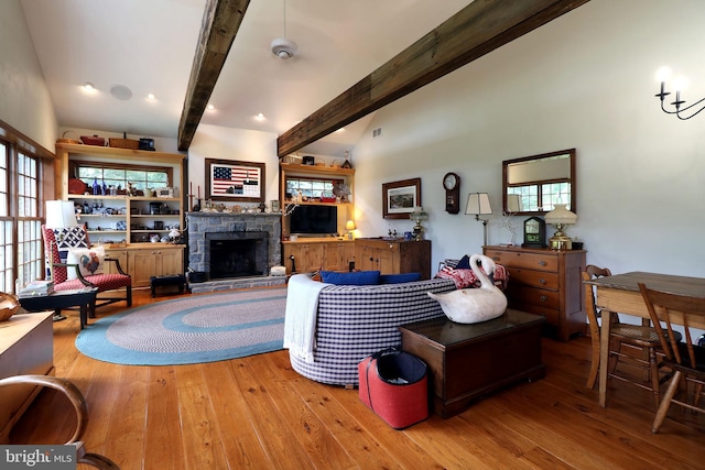 320 Hartswick Ave, State College, PA 16803 - living room featuring hardwood / wood-style floors, beamed ceiling, and a stone fireplace