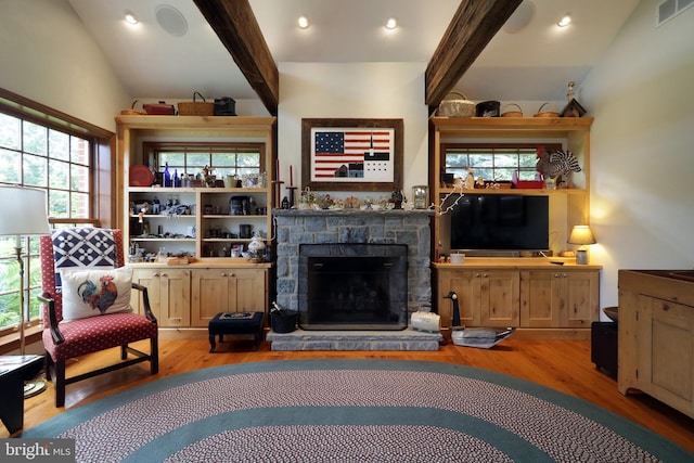 320 Hartswick Ave, State College, PA 16803 - living room featuring wood finished floors and a stone fireplace