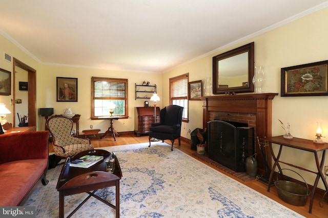 320 Hartswick Ave, State College, PA 16803 - living room featuring wood finished floors, a fireplace, and ornamental molding