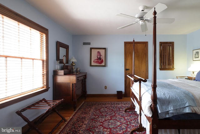 320 Hartswick Ave, State College, PA 16803 - bedroom with wood finished floors, multiple windows, and a ceiling fan
