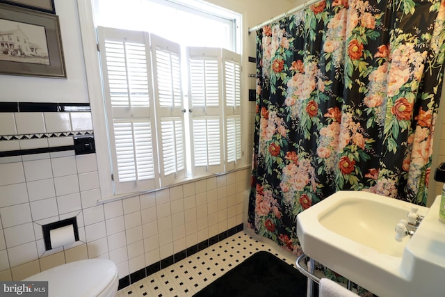 320 Hartswick Ave, State College, PA 16803 - bathroom featuring tile walls and a shower with shower curtain