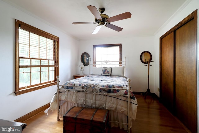 320 Hartswick Ave, State College, PA 16803 - bedroom with wood finished floors, crown molding, a ceiling fan, and a closet