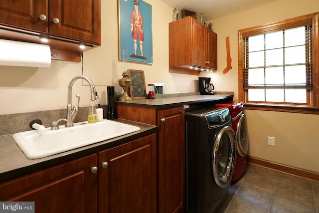 320 Hartswick Ave, State College, PA 16803 - laundry area featuring washer and dryer, cabinet space, and dark tile patterned floors