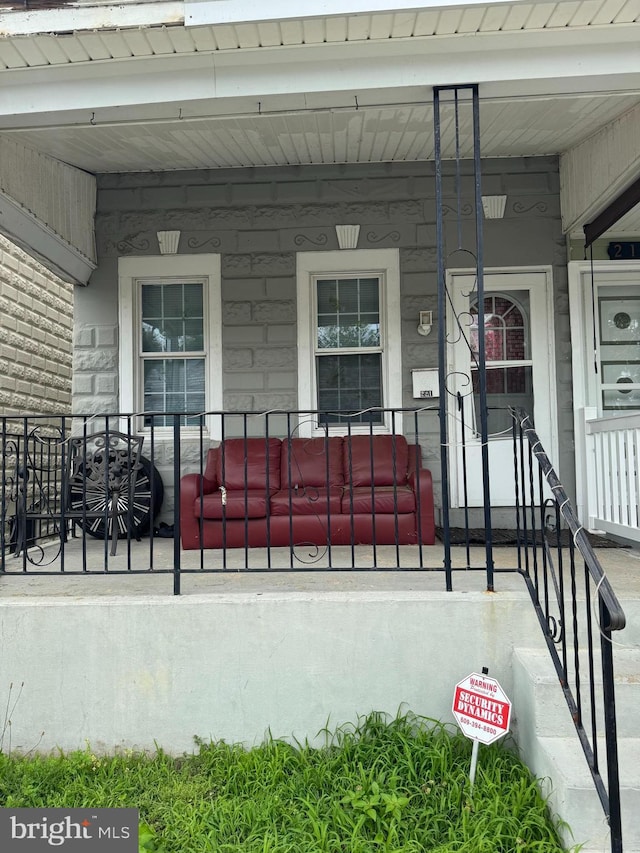 221 Buchanan Ave, Hamilton, NJ 08610 - view of exterior entry featuring a porch and stone siding
