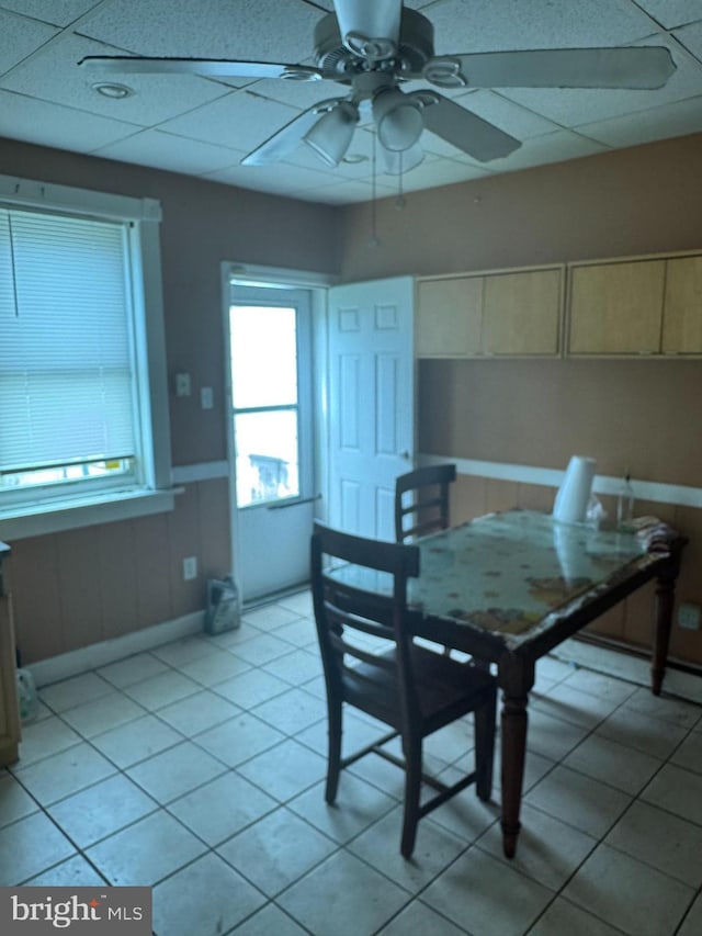 221 Buchanan Ave, Hamilton, NJ 08610 - dining area with a ceiling fan, light tile patterned floors, and a wainscoted wall