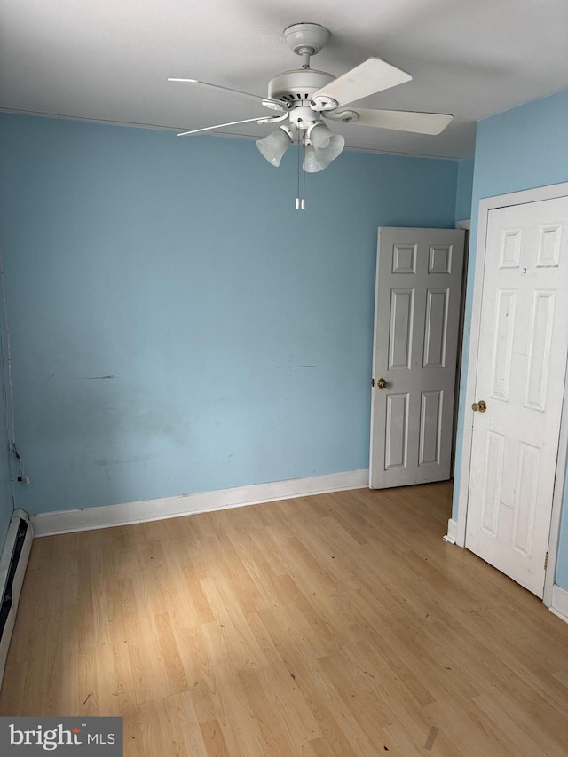 221 Buchanan Ave, Hamilton, NJ 08610 - spare room with ceiling fan, a baseboard radiator, and light wood-style flooring
