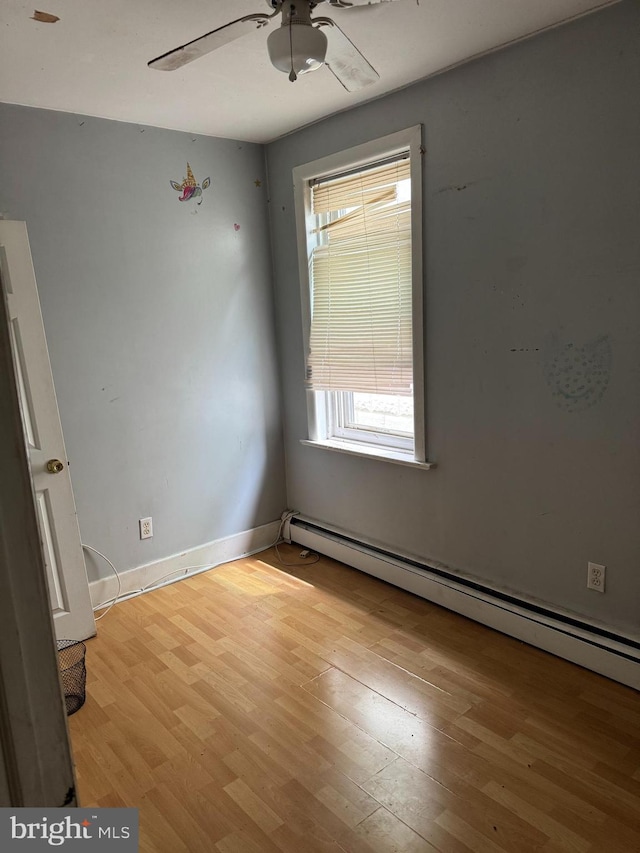 221 Buchanan Ave, Hamilton, NJ 08610 - unfurnished room featuring a baseboard heating unit, ceiling fan, and wood finished floors