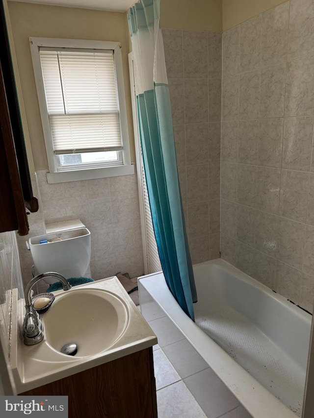 221 Buchanan Ave, Hamilton, NJ 08610 - full bath with tile patterned floors, tile walls, vanity, and shower / bathtub combination with curtain