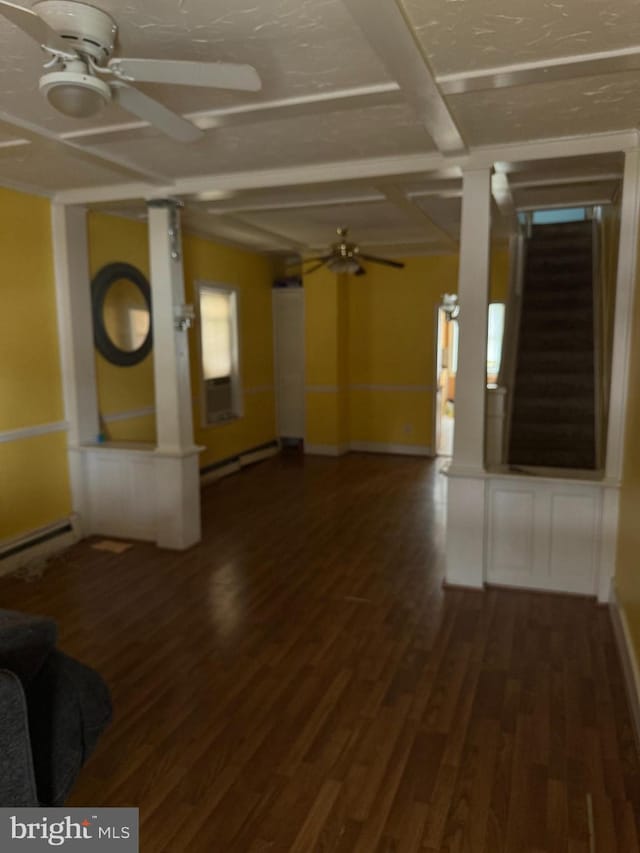 221 Buchanan Ave, Hamilton, NJ 08610 - unfurnished living room featuring a ceiling fan, a baseboard radiator, wood finished floors, and decorative columns