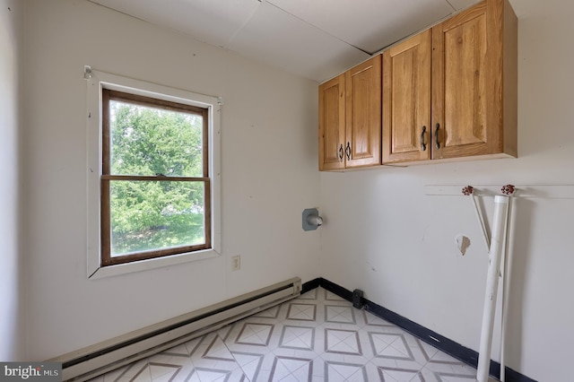 521 Concord Ln, Columbia, PA 17512 - laundry area featuring a baseboard heating unit and cabinet space