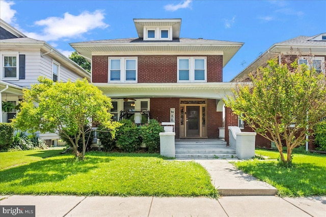 708 Maryland Ave, York, PA 17404 - traditional style home featuring brick siding, a porch, and a front lawn