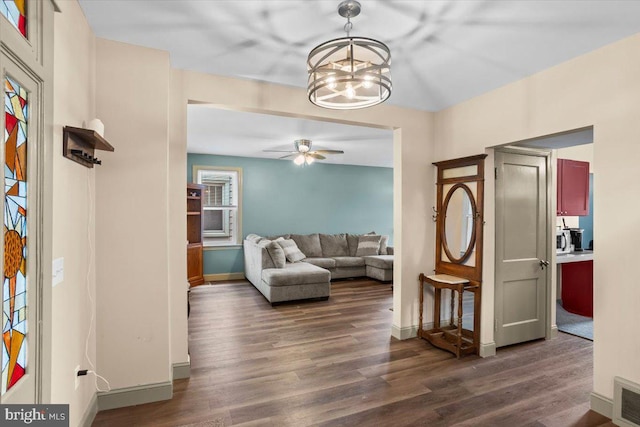 708 Maryland Ave, York, PA 17404 - living area with dark wood finished floors, a chandelier, and ceiling fan