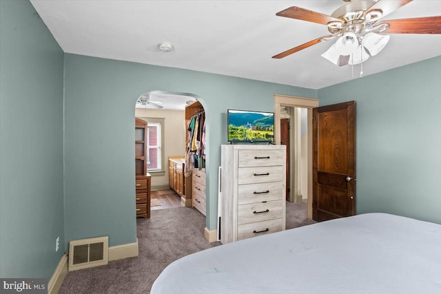 708 Maryland Ave, York, PA 17404 - carpeted bedroom featuring arched walkways and ceiling fan