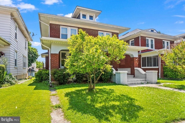 708 Maryland Ave, York, PA 17404 - traditional style home featuring brick siding and a front lawn