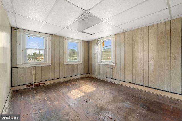 901 Fairview St, Camden, NJ 08104 - spare room with wood-type flooring, a paneled ceiling, and wooden walls