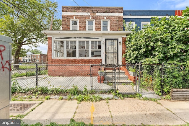 901 Fairview St, Camden, NJ 08104 - view of front of home with brick siding, a gate, and a fenced front yard