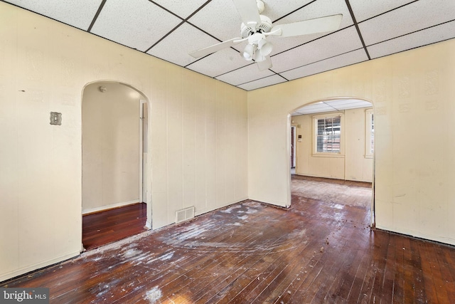 901 Fairview St, Camden, NJ 08104 - unfurnished room featuring arched walkways, hardwood / wood-style floors, a paneled ceiling, and a ceiling fan