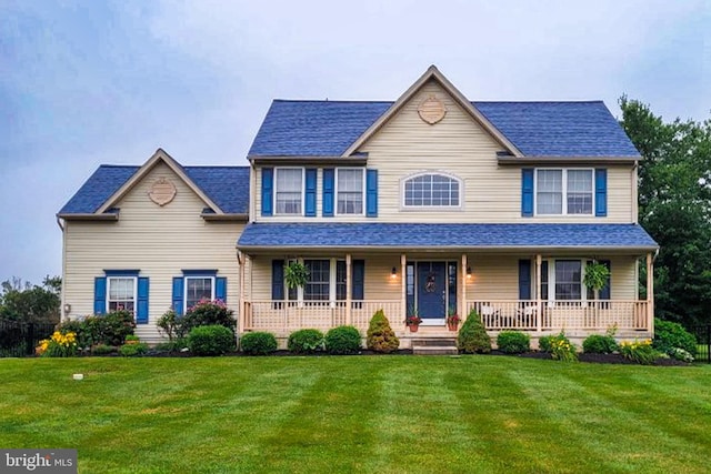 303 Briarwood, Woolwich Twp, NJ 08085 - view of front facade featuring covered porch, a front yard, and a shingled roof