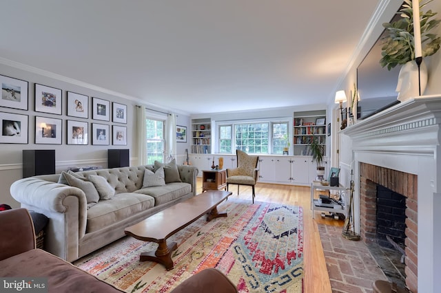 1228 Hunsicker Rd, Lancaster, PA 17601 - living room featuring crown molding, a brick fireplace, and brick floors