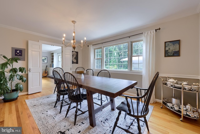 1228 Hunsicker Rd, Lancaster, PA 17601 - dining area with crown molding, a chandelier, and light wood-style floors