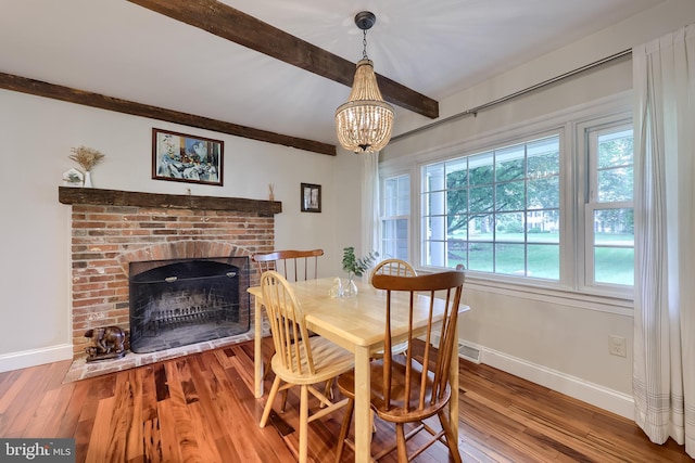 1228 Hunsicker Rd, Lancaster, PA 17601 - dining room featuring beamed ceiling, wood finished floors, a fireplace, and a chandelier