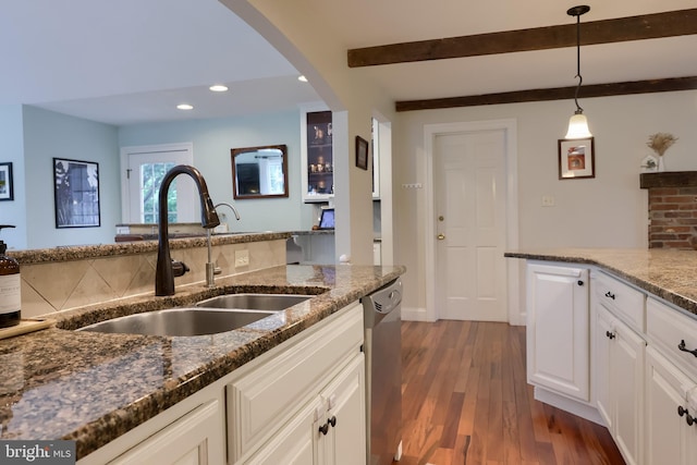 1228 Hunsicker Rd, Lancaster, PA 17601 - kitchen with dark wood-style floors, dark stone countertops, recessed lighting, stainless steel dishwasher, and white cabinets