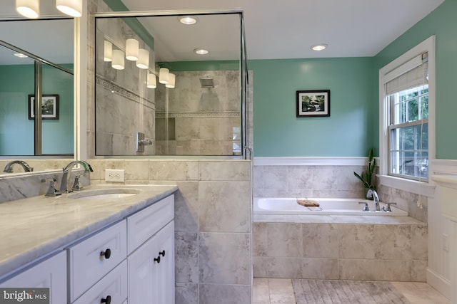 1228 Hunsicker Rd, Lancaster, PA 17601 - bathroom featuring vanity, a garden tub, a tile shower, and recessed lighting