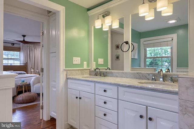 1228 Hunsicker Rd, Lancaster, PA 17601 - ensuite bathroom with double vanity, wood finished floors, and wainscoting