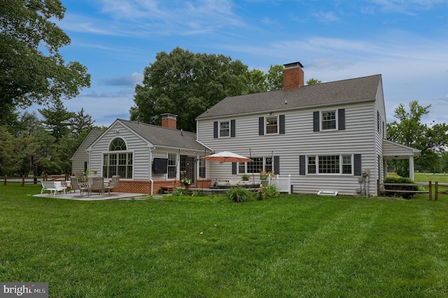1228 Hunsicker Rd, Lancaster, PA 17601 - rear view of property with a patio area, a yard, and a chimney
