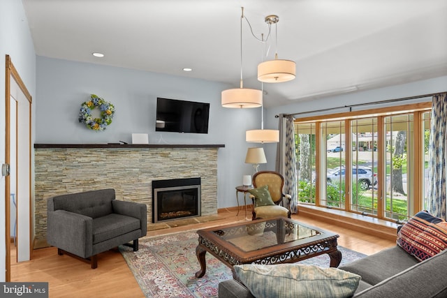 606 Hilltop Rd, Cinnaminson, NJ 08077 - living room featuring wood finished floors and a stone fireplace
