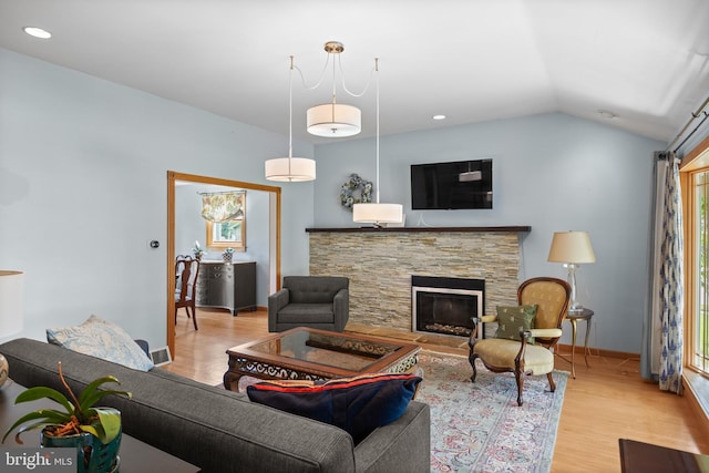 606 Hilltop Rd, Cinnaminson, NJ 08077 - living area with wood finished floors, vaulted ceiling, a stone fireplace, and recessed lighting