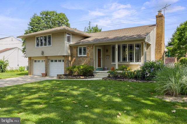 606 Hilltop Rd, Cinnaminson, NJ 08077 - tri-level home featuring concrete driveway, a garage, a front yard, and a chimney