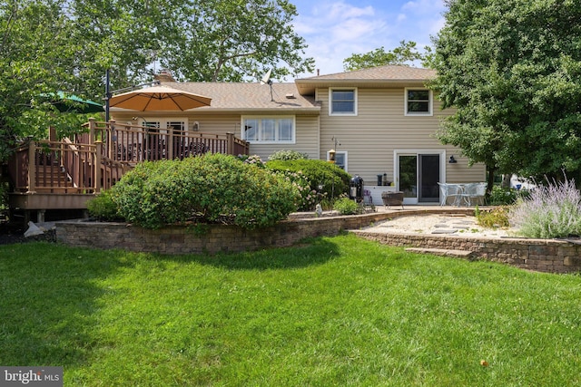 606 Hilltop Rd, Cinnaminson, NJ 08077 - rear view of property featuring a wooden deck and a lawn