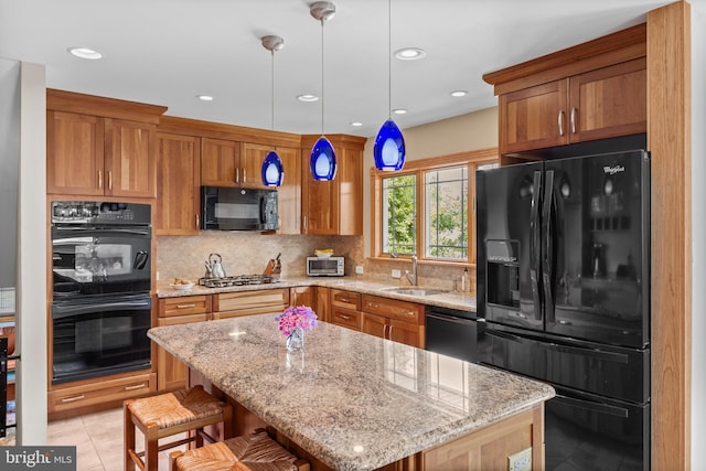 606 Hilltop Rd, Cinnaminson, NJ 08077 - kitchen with black appliances, decorative backsplash, light stone counters, decorative light fixtures, and recessed lighting